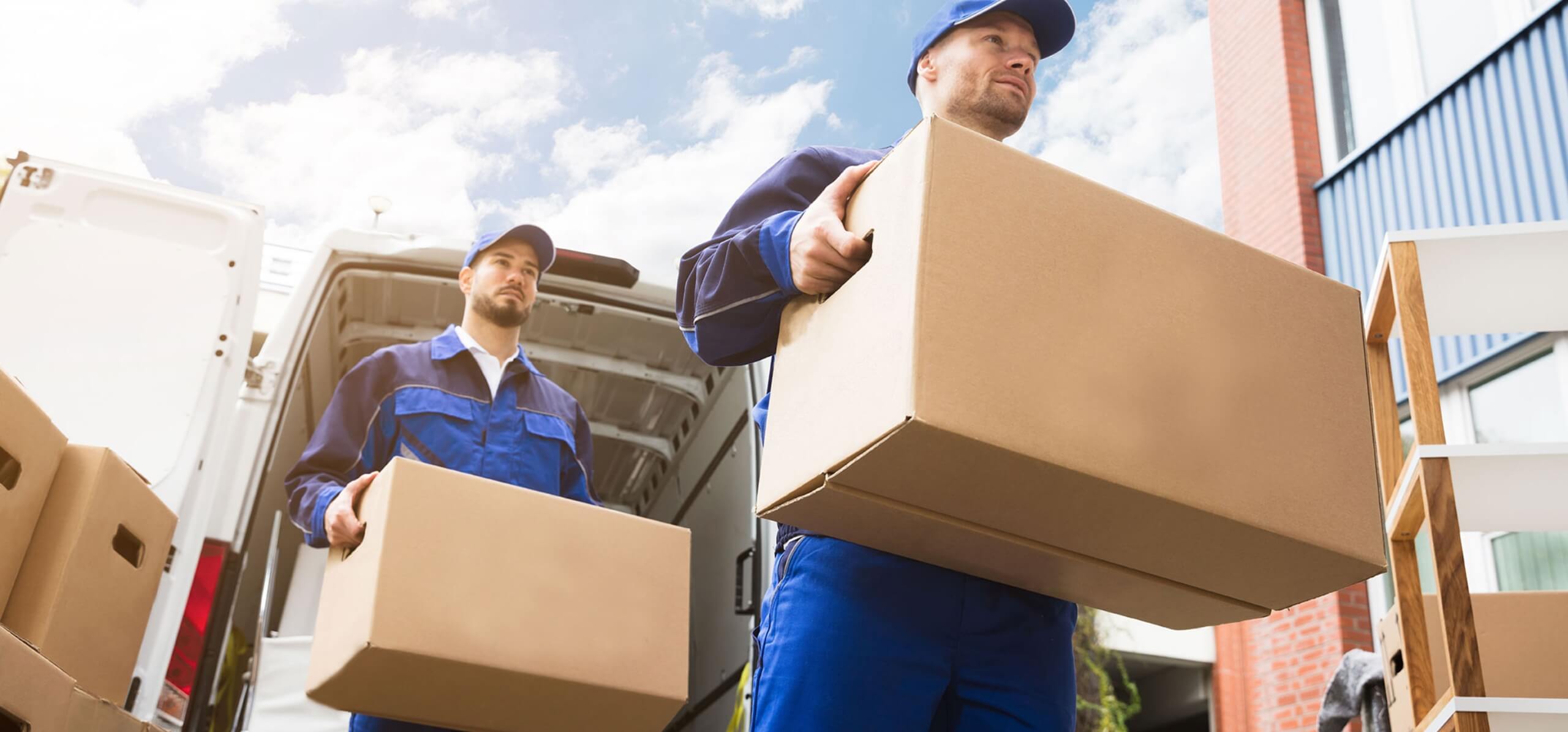 Local moving services — movers loading furniture into truck